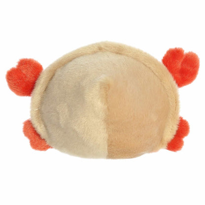 The rear view of the tan and orange Aurora crab stuffed animal displaying the rounded details of its plush spiral shell.