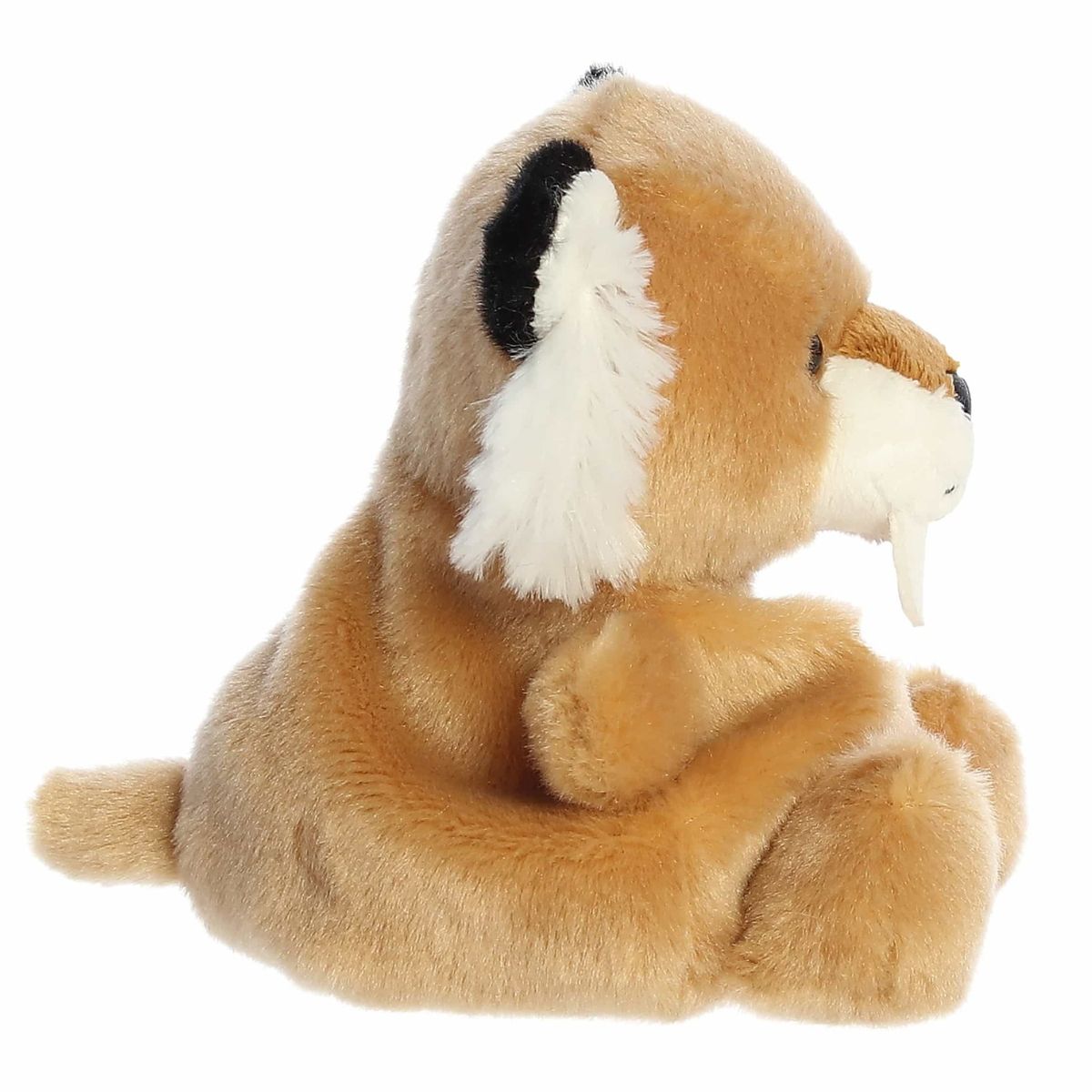 The right side profile view of the sitting Aurora Palm Pals saber tooth tiger plush highlighting its relaxed posture.