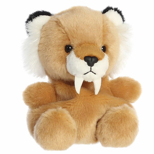 Aurora Palm Pals Ash 5-inch Saber Tooth Tiger plush stuffed toy sitting forward with tan fur and two long white fangs.