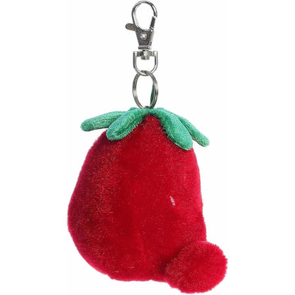 Side profile of the soft red Palm Pals strawberry clip-on stuffed animal showing its round shape.