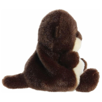 Side profile of the Aurora Palm Pals Elena River Otter plush highlighting its long brown tail and round shape.