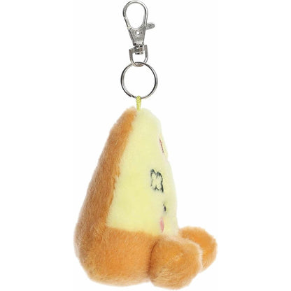 Side profile view of the Peppa Pizza plush keychain showing its golden brown crust and metal clip.