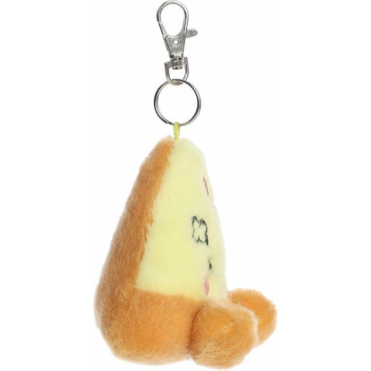 Side profile view of the Peppa Pizza plush keychain showing its golden brown crust and metal clip.