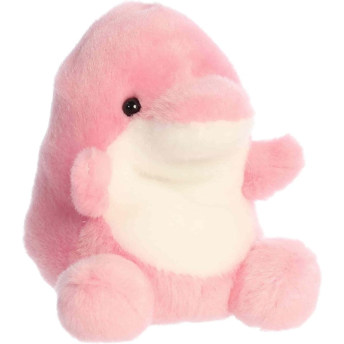 Angled view of the Aurora Palm Pals 5-inch Amazonia Pink Dolphin plush sitting upright, showing its bright pink body, white belly, and rounded snout.