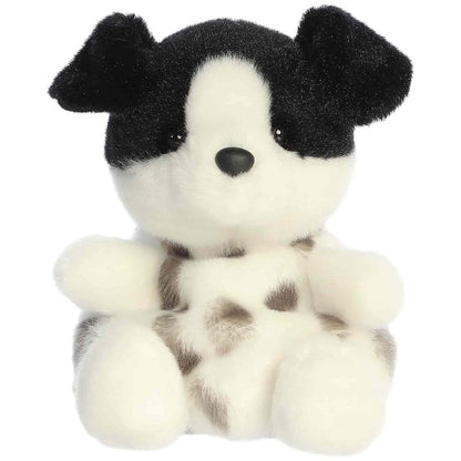 Straight front sitting view of the black and white dog plush showing its speckled belly, white snout, and cute black nose.