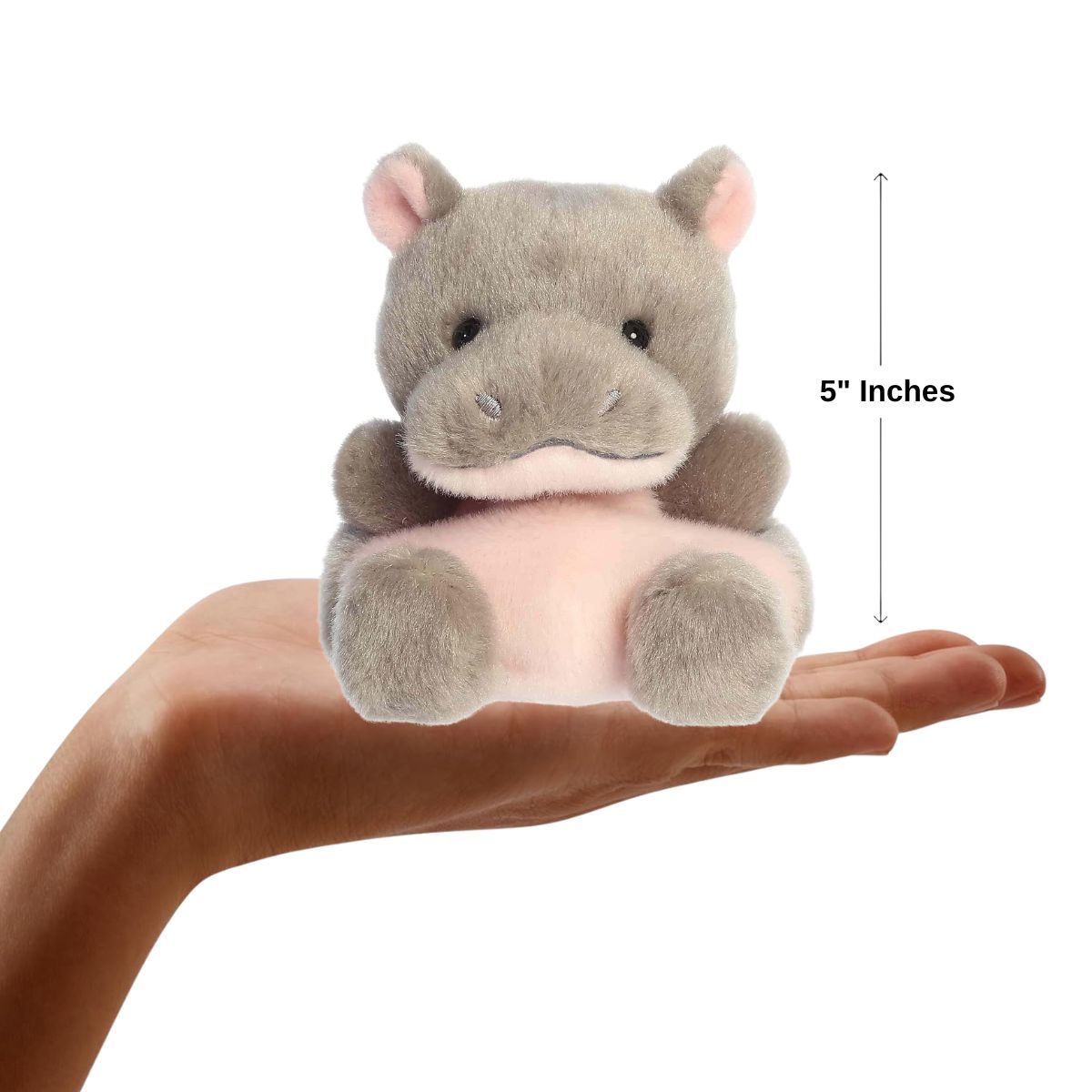 Dimension graphic showing the 5-inch Aurora Palm Pals Ham Pygmy Hippo resting comfortably in a person's hand.