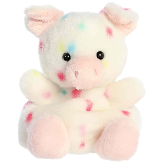 Straight front sitting view of the funfetti pig plush showing its pastel polka dots, black eyes, and plush pink feet.
