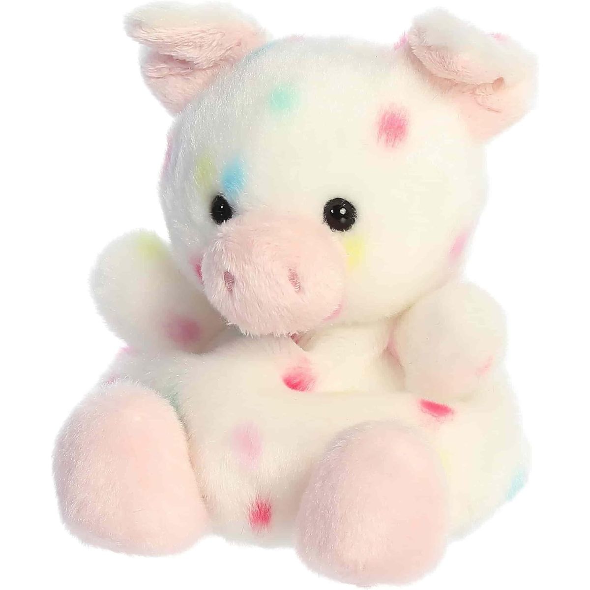 Angled front view showing the speckled white plush pig sitting happily.