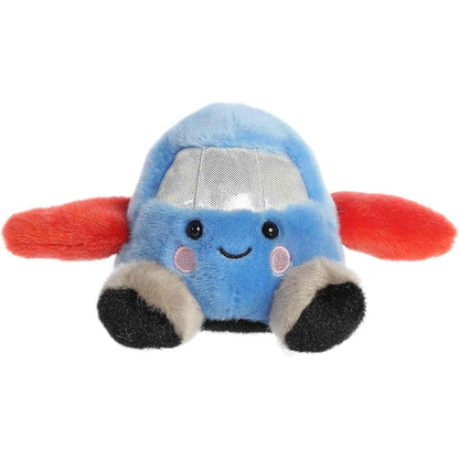 Straight front sitting view of the airplane plush showing its red wings out to the sides, silver window, rosy cheeks, and black plush wheel feet.