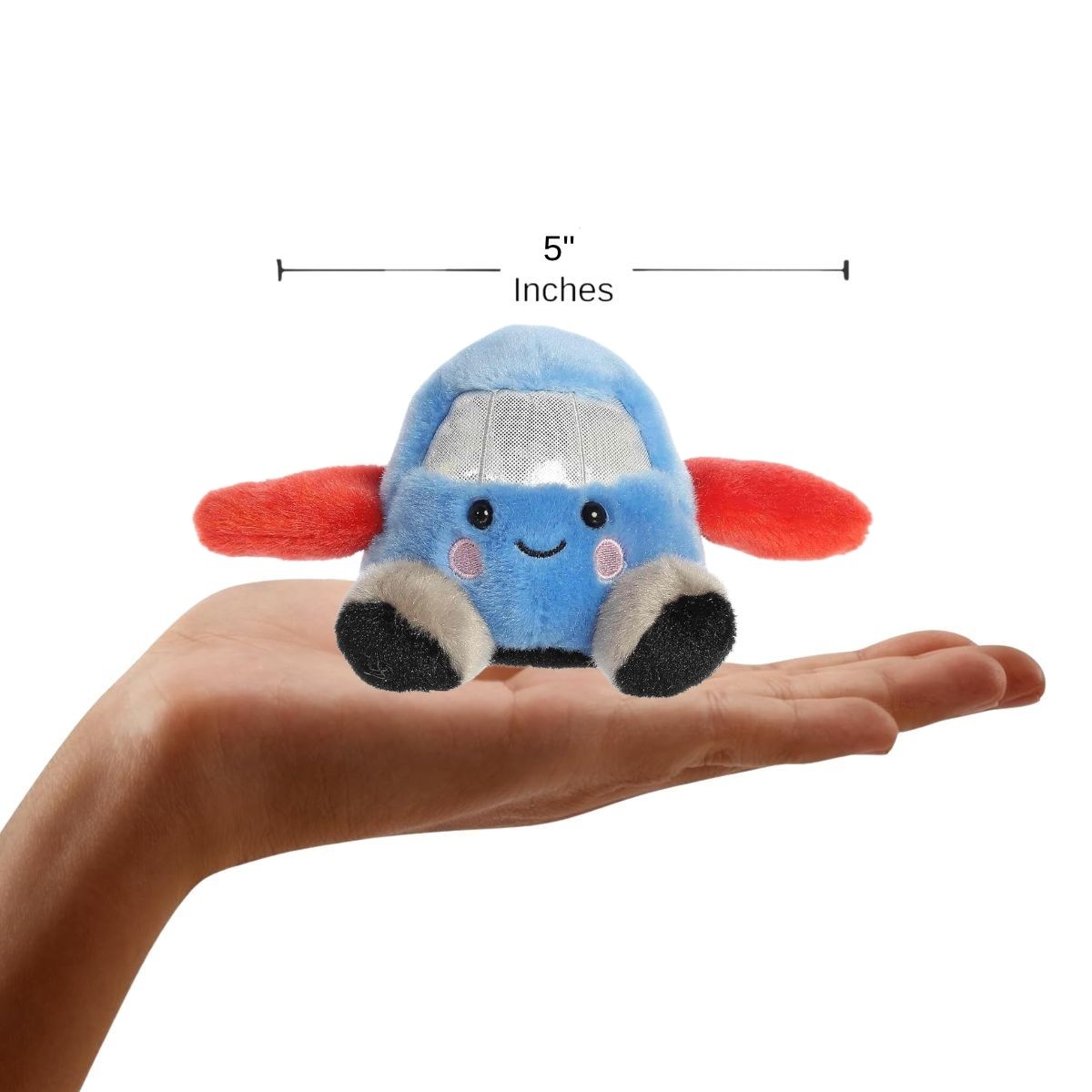 Sizing graphic showing the 5-inch Palm Pals Amelia Jet plush sitting perfectly in the palm of a hand to demonstrate its small scale.