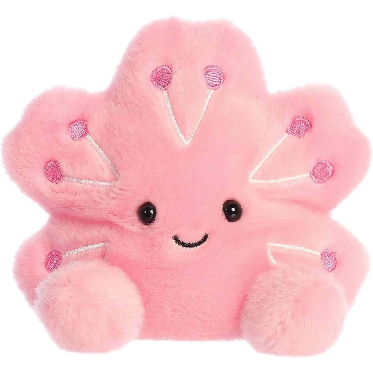 Straight front sitting view of the pink cherry blossom plush showing its five petals, embroidered stamen details, and happy smile.