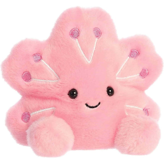 Front angled view of the 5-inch Aurora Palm Pals Hana Cherry Blossom plush toy featuring a pink petal shape and a sweet embroidered face.