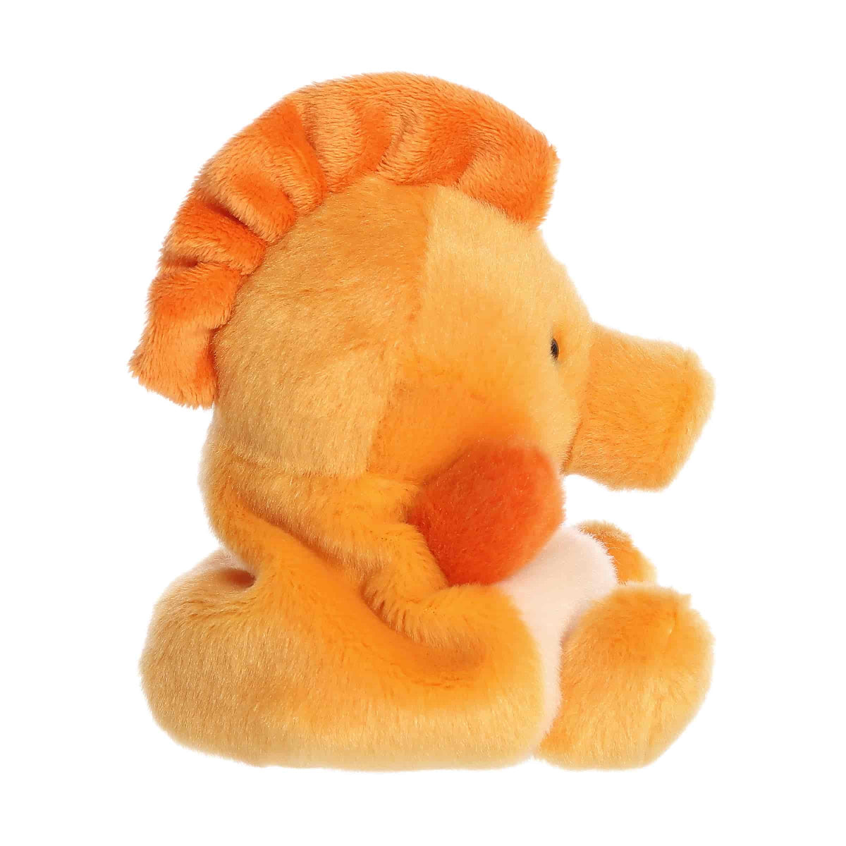 Side profile view of the Palm Pals Felipe Seahorse highlighting its plump shape and the dark orange fin running down its back.
