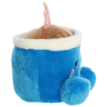 Side profile of the Aurora Palm Pals Tariq Coffee plush highlighting its handle and the thin side of the donut.