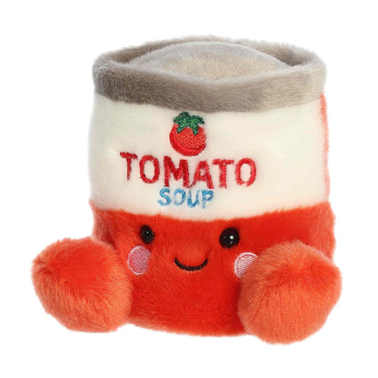 Sizing graphic showing the 5-inch Palm Pals Andy Tomato Soup Can plush sitting perfectly in the palm of a hand to demonstrate its small scale.