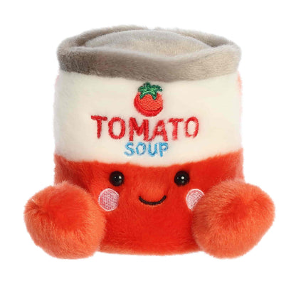 Straight front sitting view of the tomato soup can plush showing its embroidered label, rosy cheeks, and little red feet.