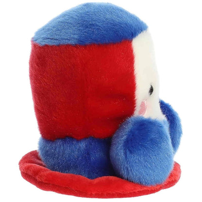 Side profile of the Aurora Palm Pals Freedom Hat plush highlighting its red brim and round shape.