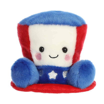 Front view of the 5-inch Aurora Palm Pals Freedom Hat plush toy featuring a red, white, and blue design.
