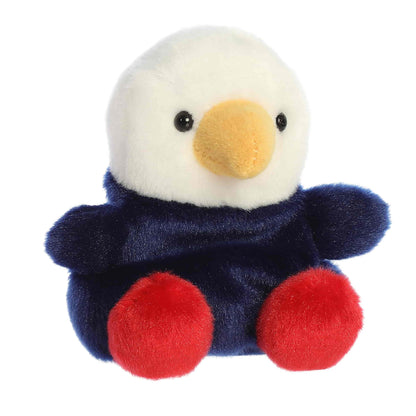 Angled front view of the soft red, white, and blue Palm Pals bald eagle plush sitting upright.