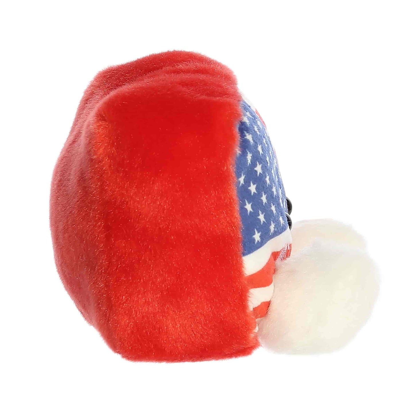 Side profile of the Aurora Palm Pals Indivisible Flag plush highlighting its rectangular shape and red backing.