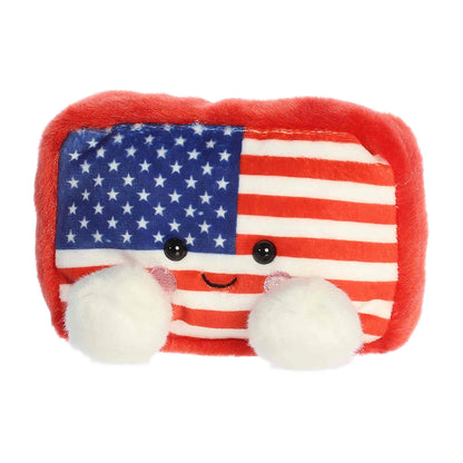 Slightly angled view of the cheerful Palm Pals Indivisible Flag plush sitting upright.