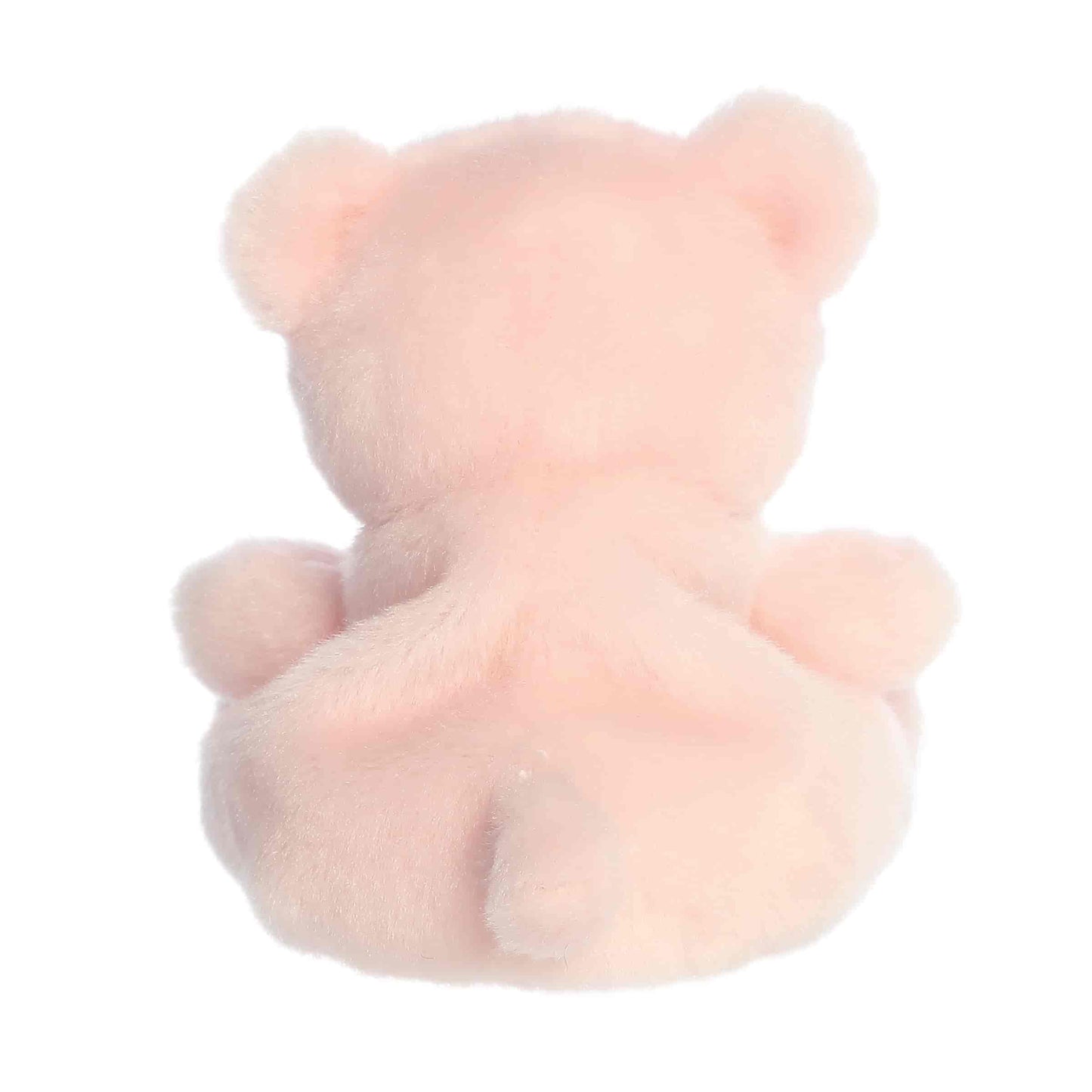 Direct back view of the cuddly light pink Palm Pals bear stuffed animal showing its round ears and tail.