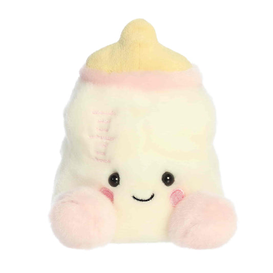 Straight-on front view of the soft cream Palm Pals baby bottle stuffed toy with a smiling face.