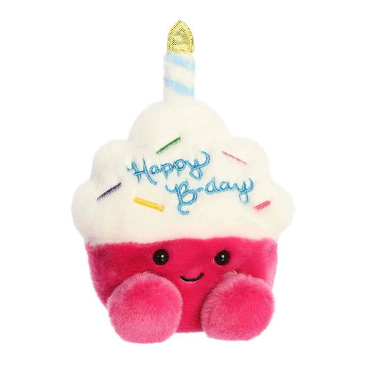 Front view of the 5-inch Aurora Palm Pals Sparkle Birthday Cupcake pink and white plush toy with a candle on top.