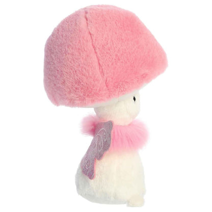 Side profile view of the pink Fungi Friends fairy plush highlighting the fluffy cap and the attachment of the pink fairy wings.