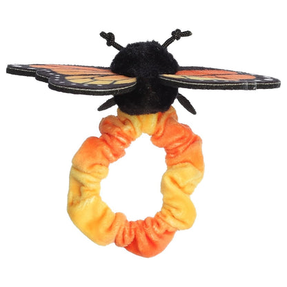Back angled view showing the underside of the Monarch wings and the bright scrunchie band.