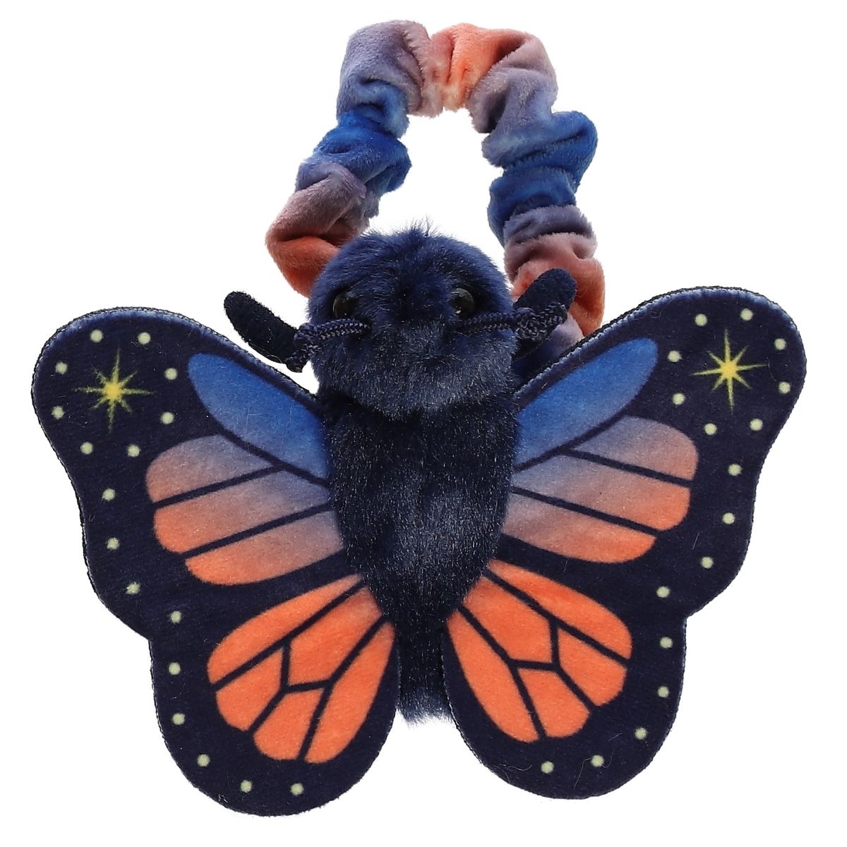 Top-down view of the dark blue and orange butterfly resting flat against its tie-dye scrunchie-style wristband.