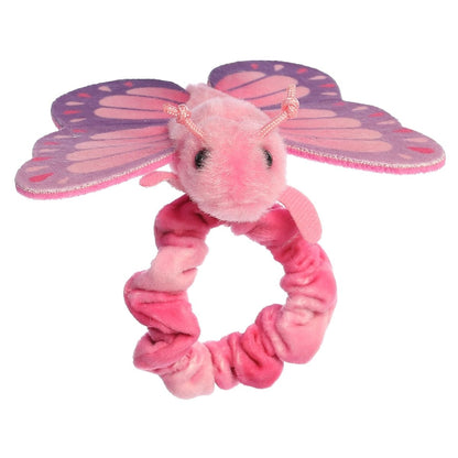 Front view of the butterfly's sweet face sitting atop the stretchy pink plush wristband.