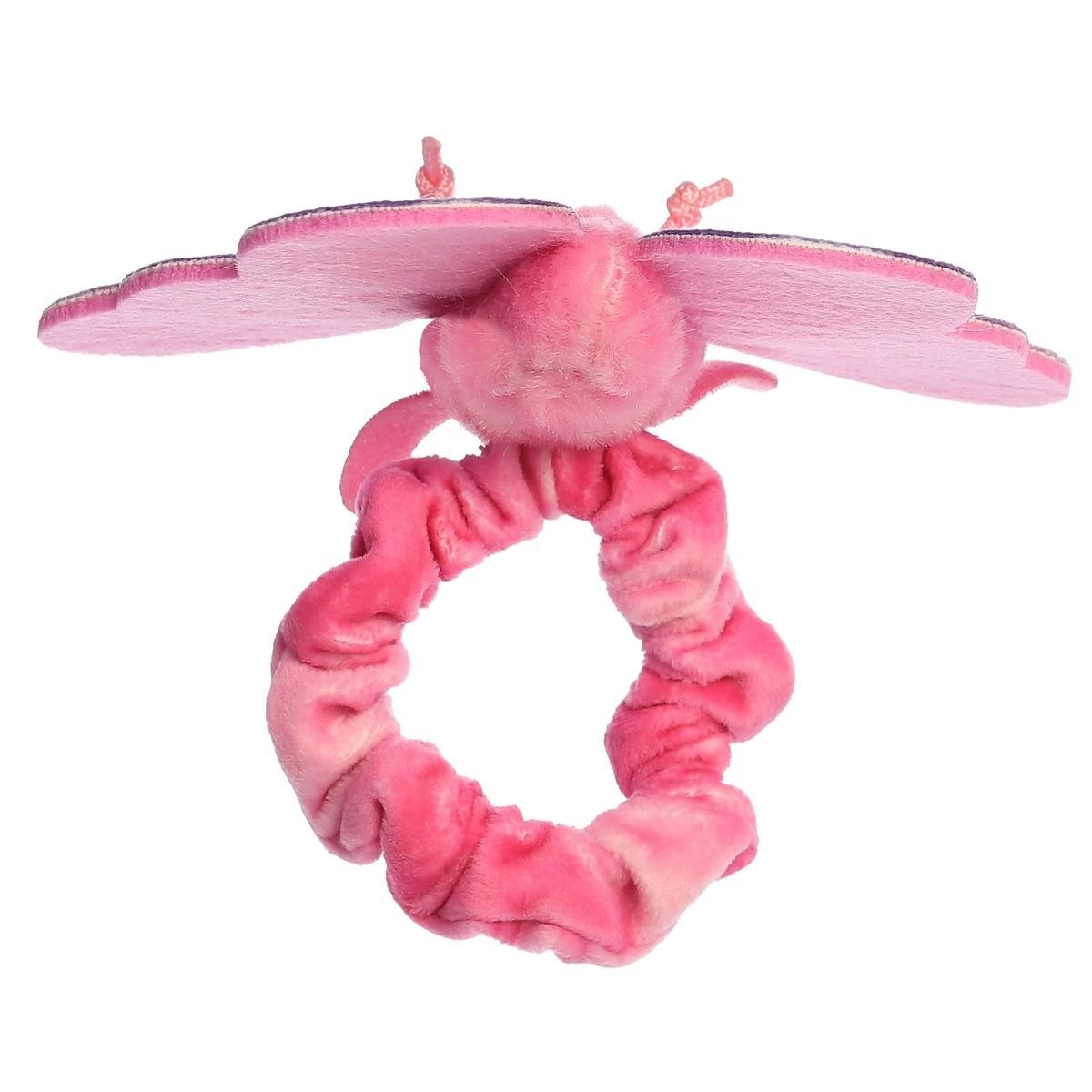 A child's arm outstretched, wearing the pink butterfly plush securely on their wrist like a bracelet.