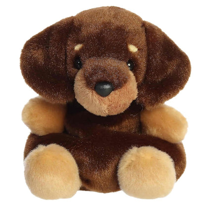 Straight front view of the Houdini Dachshund plush toy highlighting his tan eyebrows, dark nose, and upright sitting position.