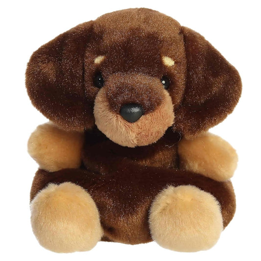 Straight front view of the Houdini Dachshund plush toy highlighting his tan eyebrows, dark nose, and upright sitting position.