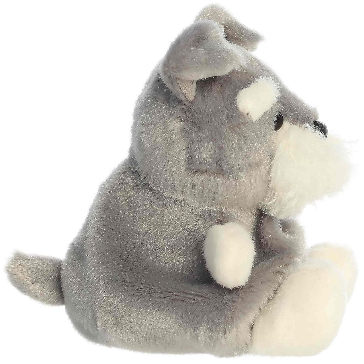 Profile angle of the small grey terrier plushie displaying her folded ears and rounded back.