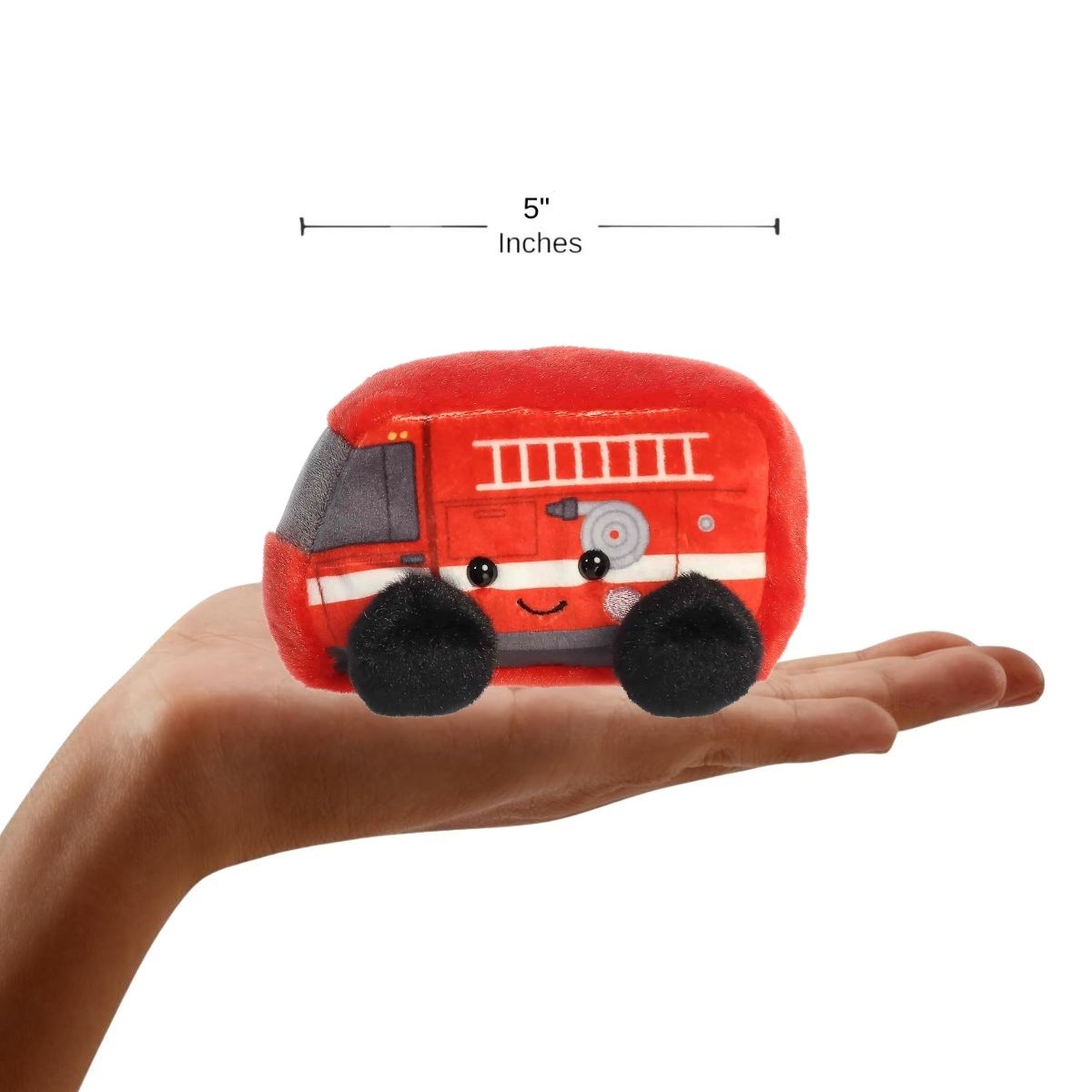 A human hand holding the five-inch Rescue Firetruck, demonstrating its miniature scale.