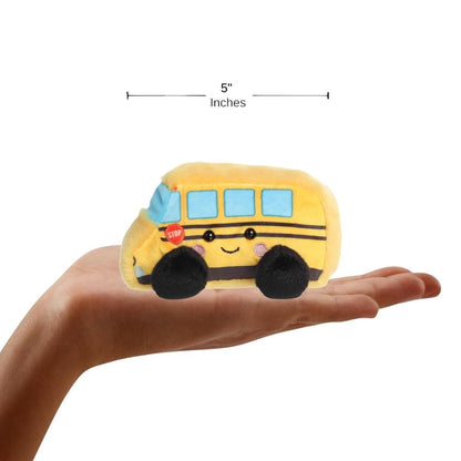A human hand holding the five-inch Friendly School Bus plush, demonstrating its miniature scale.
