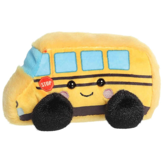 Side-angled view of the Aurora Palm Pals Friendly School Bus stuffed toy displaying a yellow body, blue windows, a stop sign, and fluffy black wheels.