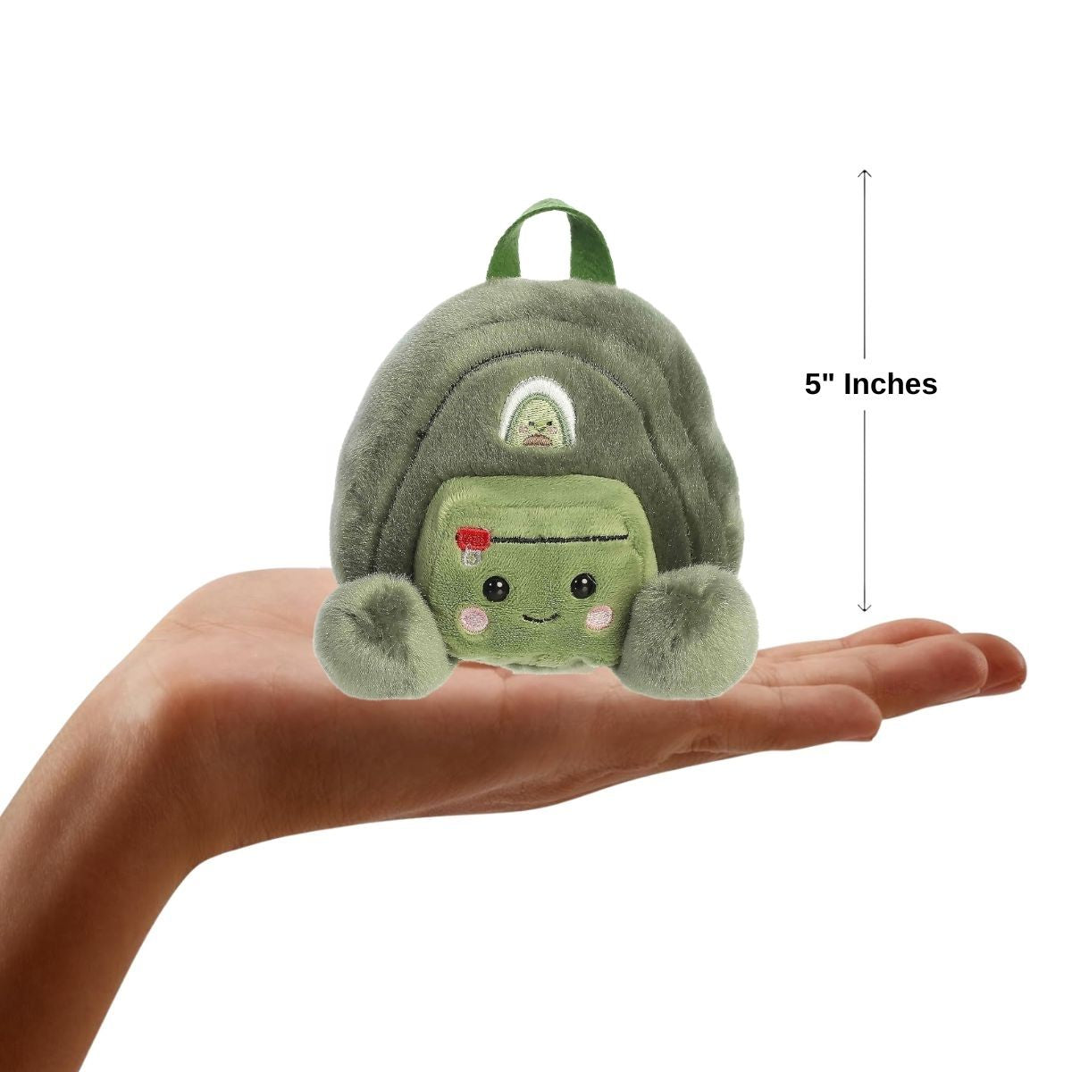A human hand holding the five-inch Rainier Backpack plush, demonstrating its compact, palm-sized proportions.
