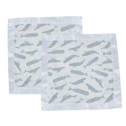 Two identical Newcastle Classics whale print bamboo lovey blankets laid out side-by-side.