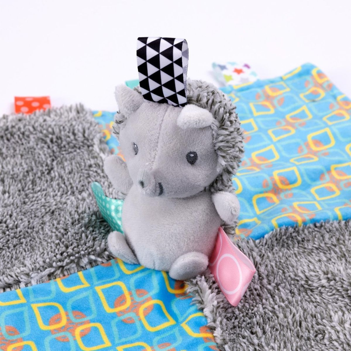 Detailed view of the dotted plush fabric on the Taggies security blanket.
