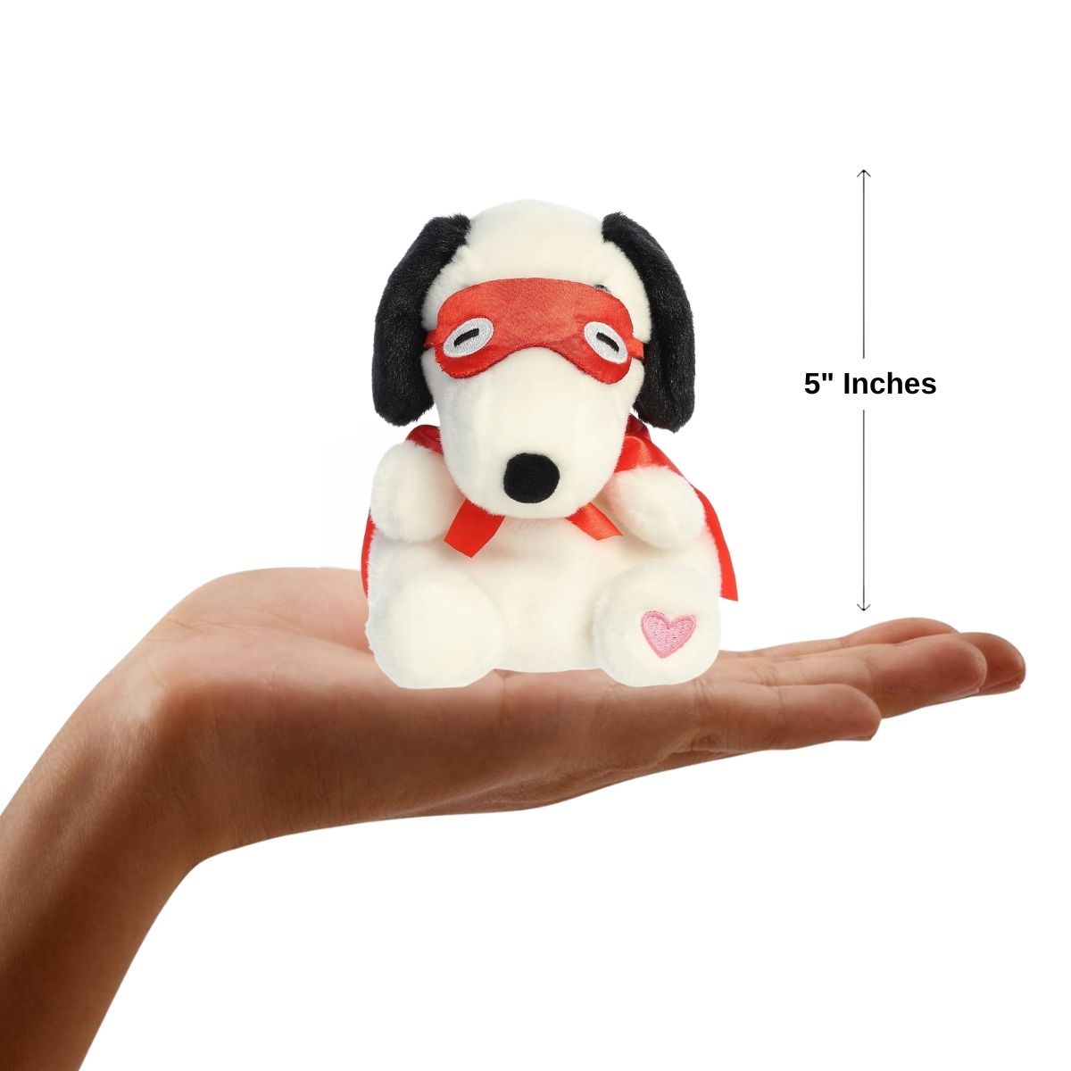 Dimension graphic showing the 5-inch Aurora Palm Pals Snoopy Kissing Bandit resting comfortably in a person's hand.