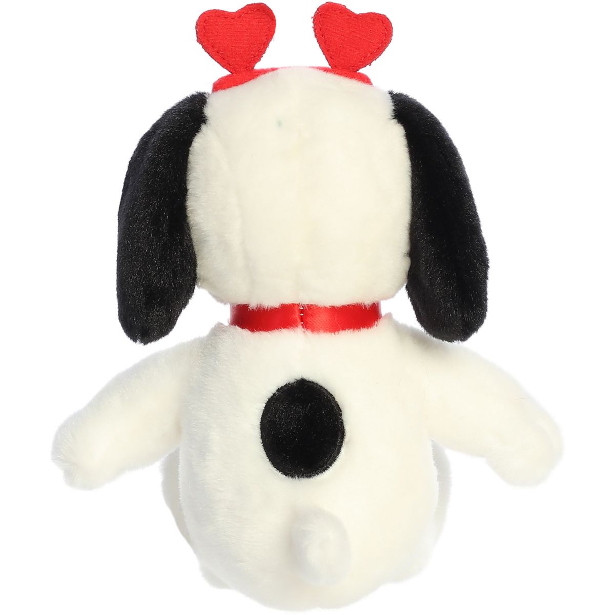 Back view of the Aurora Peanuts Snoopy plush toy showing the black spot on his back and his cute little white tail.