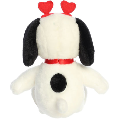 Back view of the Aurora Peanuts Snoopy plush toy showing the black spot on his back and his cute little white tail.