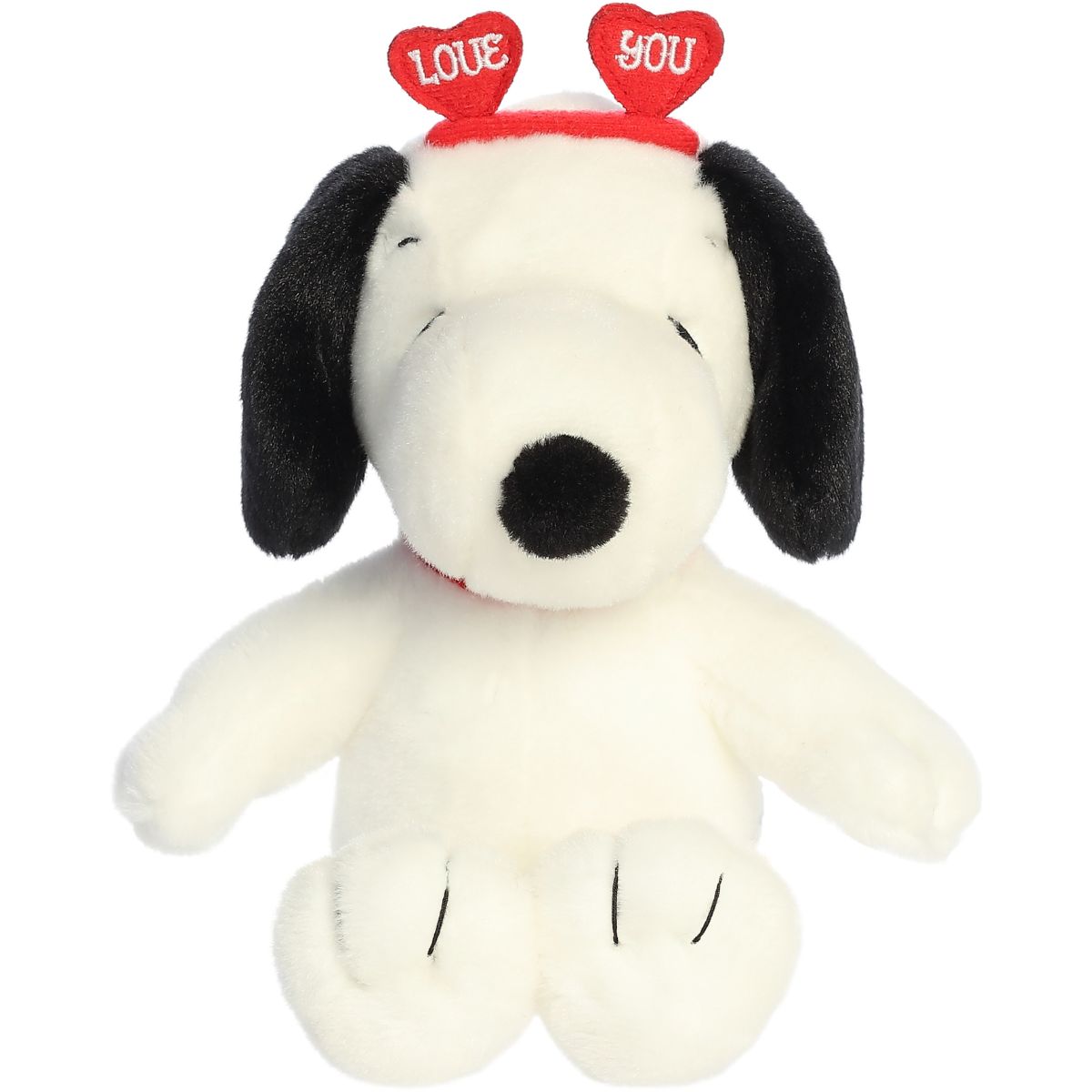 Front view of the Aurora 9-inch Peanuts Snoopy plush sitting upright, wearing his red collar and a red heart headband.