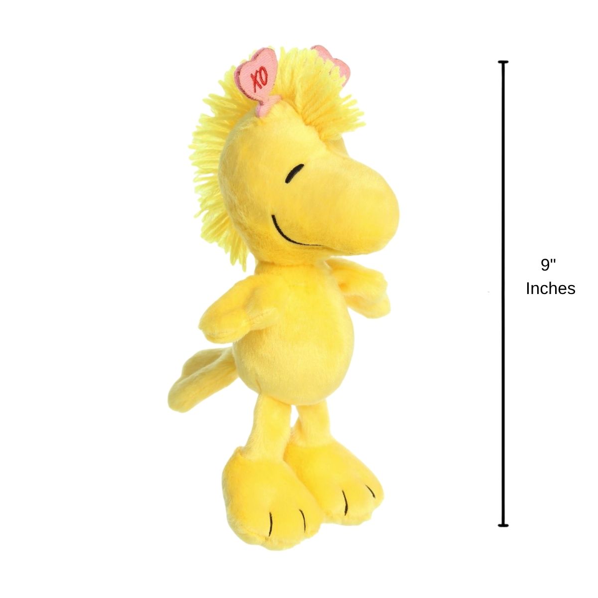 The holiday Woodstock plush standing upright next to a 9-inch vertical height graphic indicator.