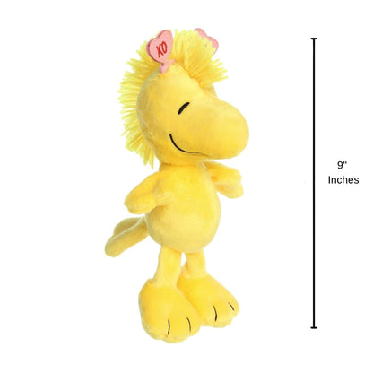 The holiday Woodstock plush standing upright next to a 9-inch vertical height graphic indicator.