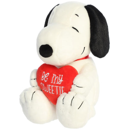 Opposite side angled profile thumbnail showing the Snoopy plush resting in a cozy seated position.