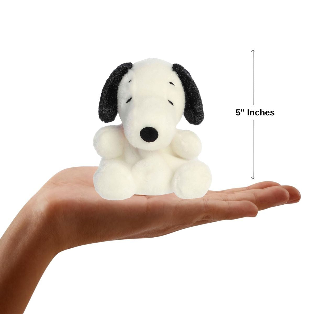 Sizing graphic for the Aurora Palm Pals Peanuts Snoopy plush showing it sitting perfectly in the palm of a hand, indicating a total height of 5 inches.
